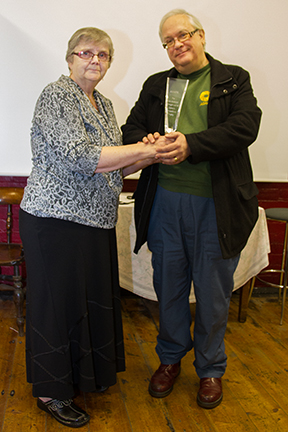 Margaret handing over to John